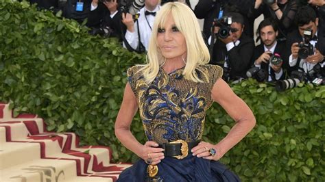 why did michael kors buy versace